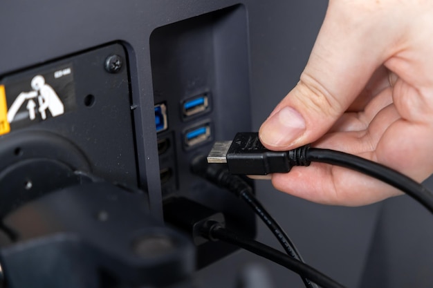 Plug an HDMI cable into a Lenovo Android laptop port for a stable connection